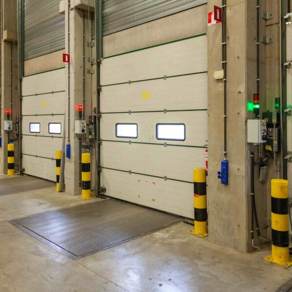 interior shot of a warehouse with a row of doors